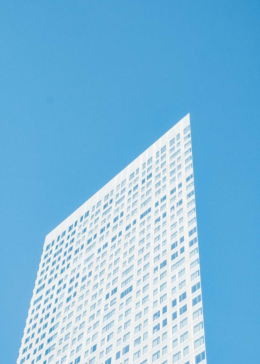 office building white and blue high building at daytime city